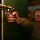 A man and his gun - Indoor Rambo Shooting